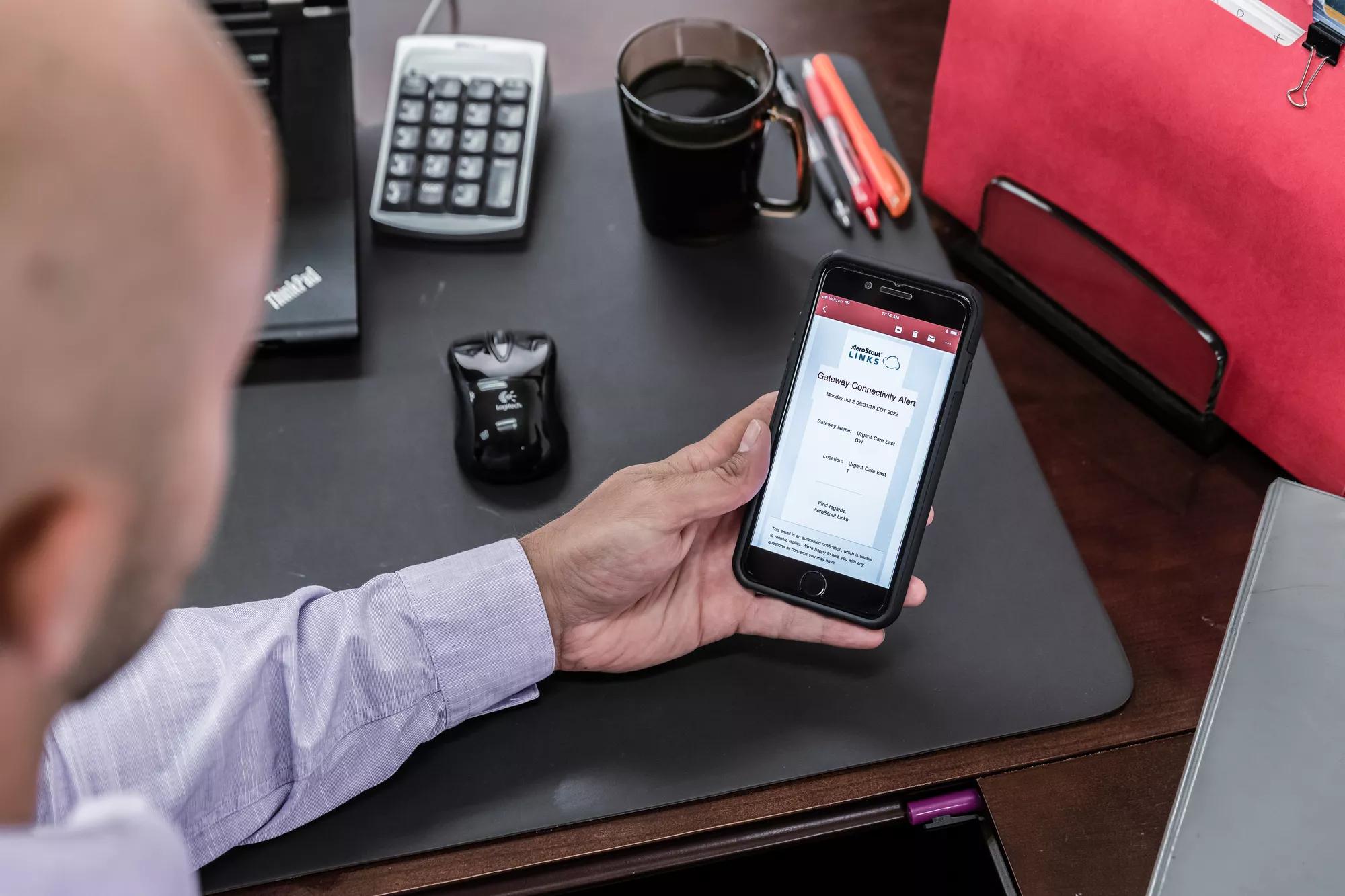 Links mobile application being viewed on a mobile device by an executive. Securitas Healthcare.