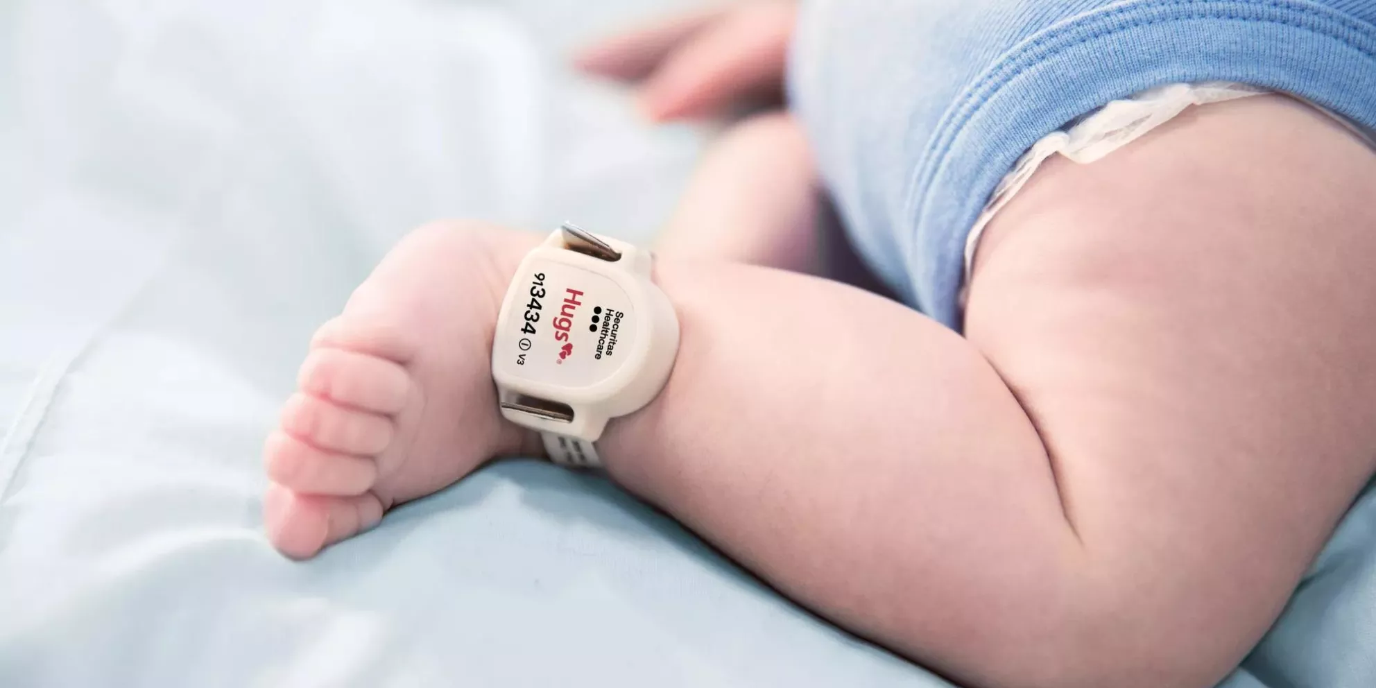 Securitas Healthcare Hugs infant protection tag attached to baby's ankle