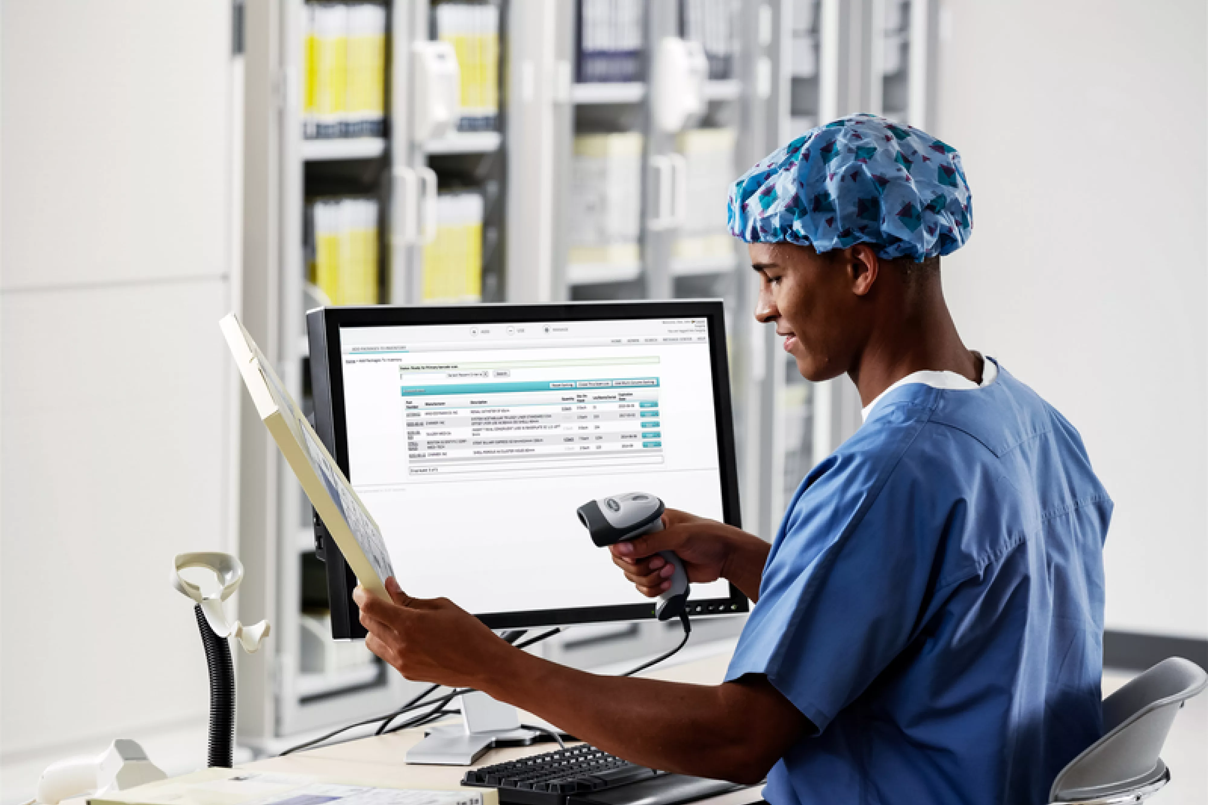 SpaceTRAX Hospital inventory management, while inventory is scanned and inventory is displayed on computer monitor. Securitas Healthcare.