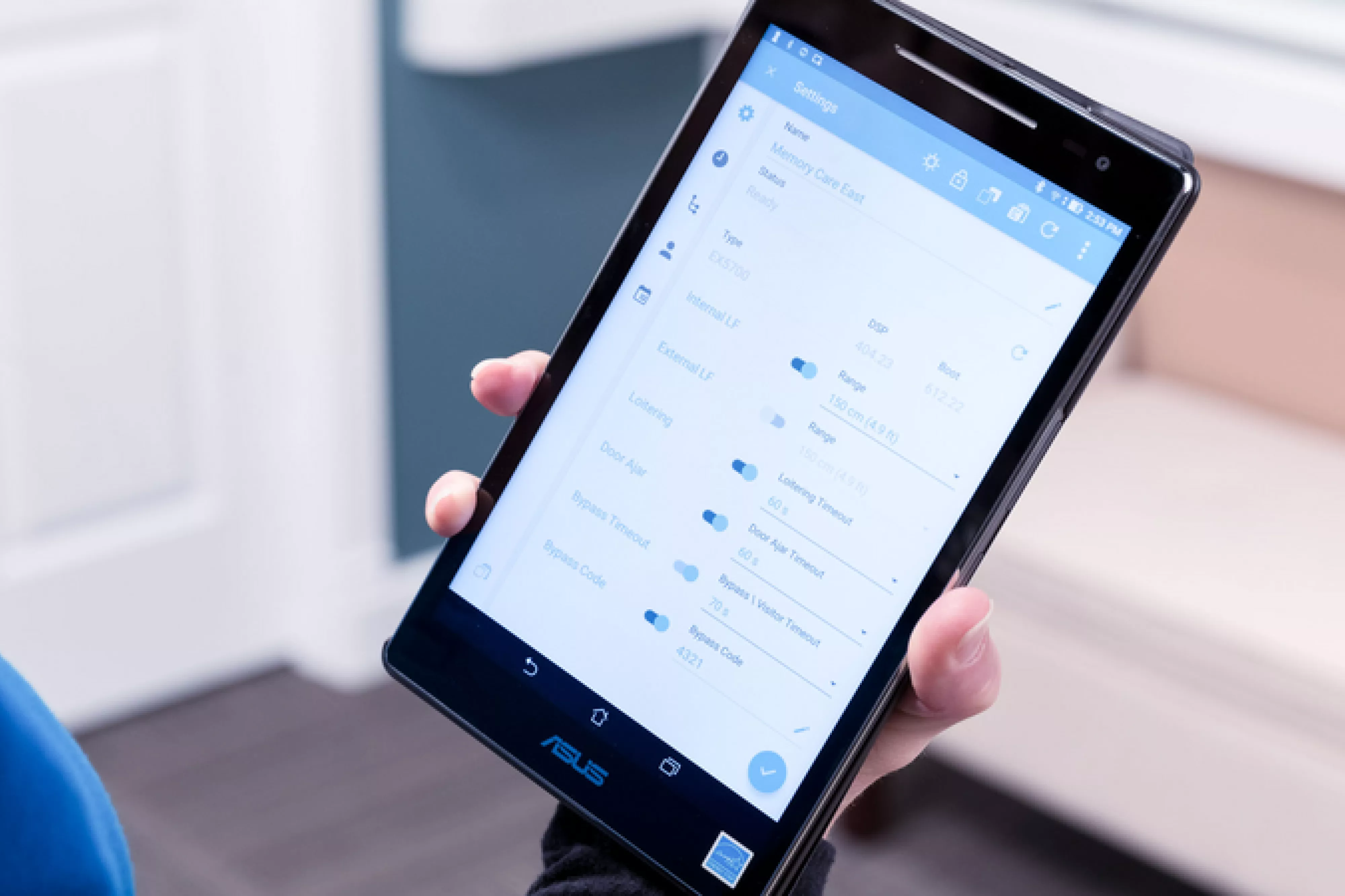 Caregiving accessing the WanderGuard BLUE solution on a tablet