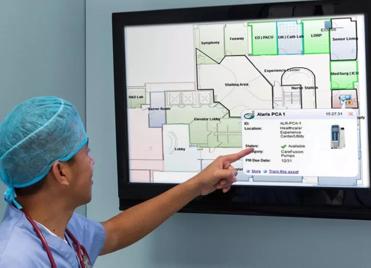Healthcare worker using Securitas MobileView - viewing a screen to identify the location of a pump.