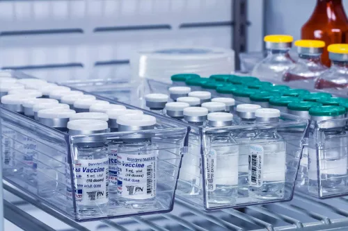 Vaccines being refrigerated while the temperature is monitored. 