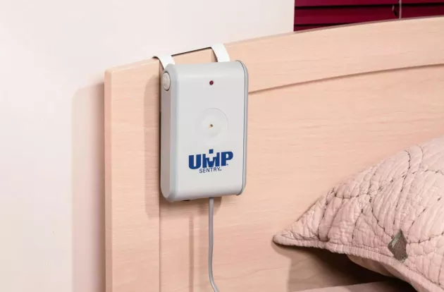 UMP Sentry Fall Monitor attached to a resident's headboard