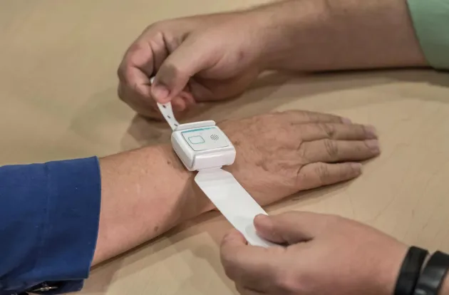 T14 Patient Flow band being applied at patient check-in. Securitas Healthcare. 