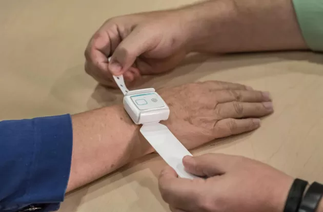 T14 Patient Flow band being applied at patient check-in. Securitas Healthcare. 