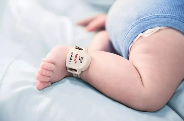 Securitas Healthcare Hugs infant protection tag attached to baby's ankle