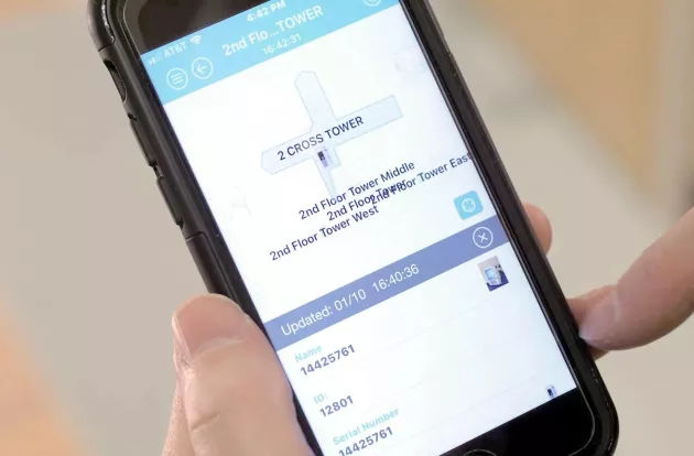 Caregiver viewing Securitas Healthcare's MobileView Locator Mobile App on their smartphone device