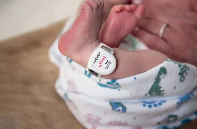Hugs tag worn on newborn ankle. Securitas Healthcare