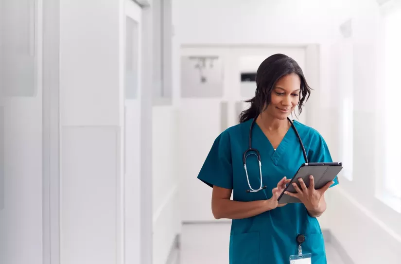 Doctor reviewing info on an iPad