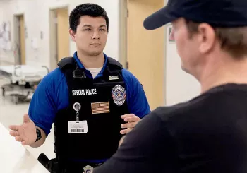 Hospital security officer confronting disruptive visitor