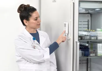 Pharmacist audits meds refrigerator temperature and humidity with Securitas Healthcare T15 environmental monitoring tag