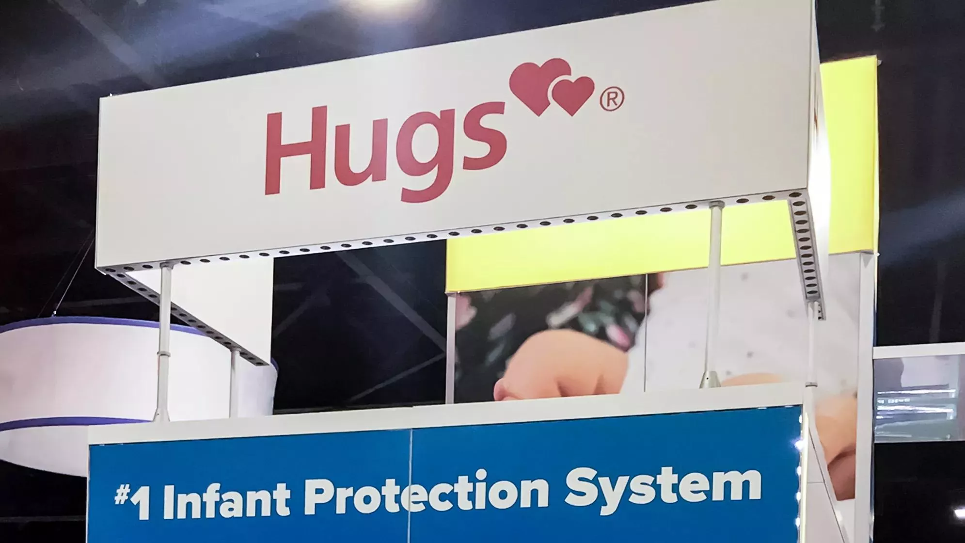 Hugs booth at AWHONN industry event. #1 infant protection system booth graphic.