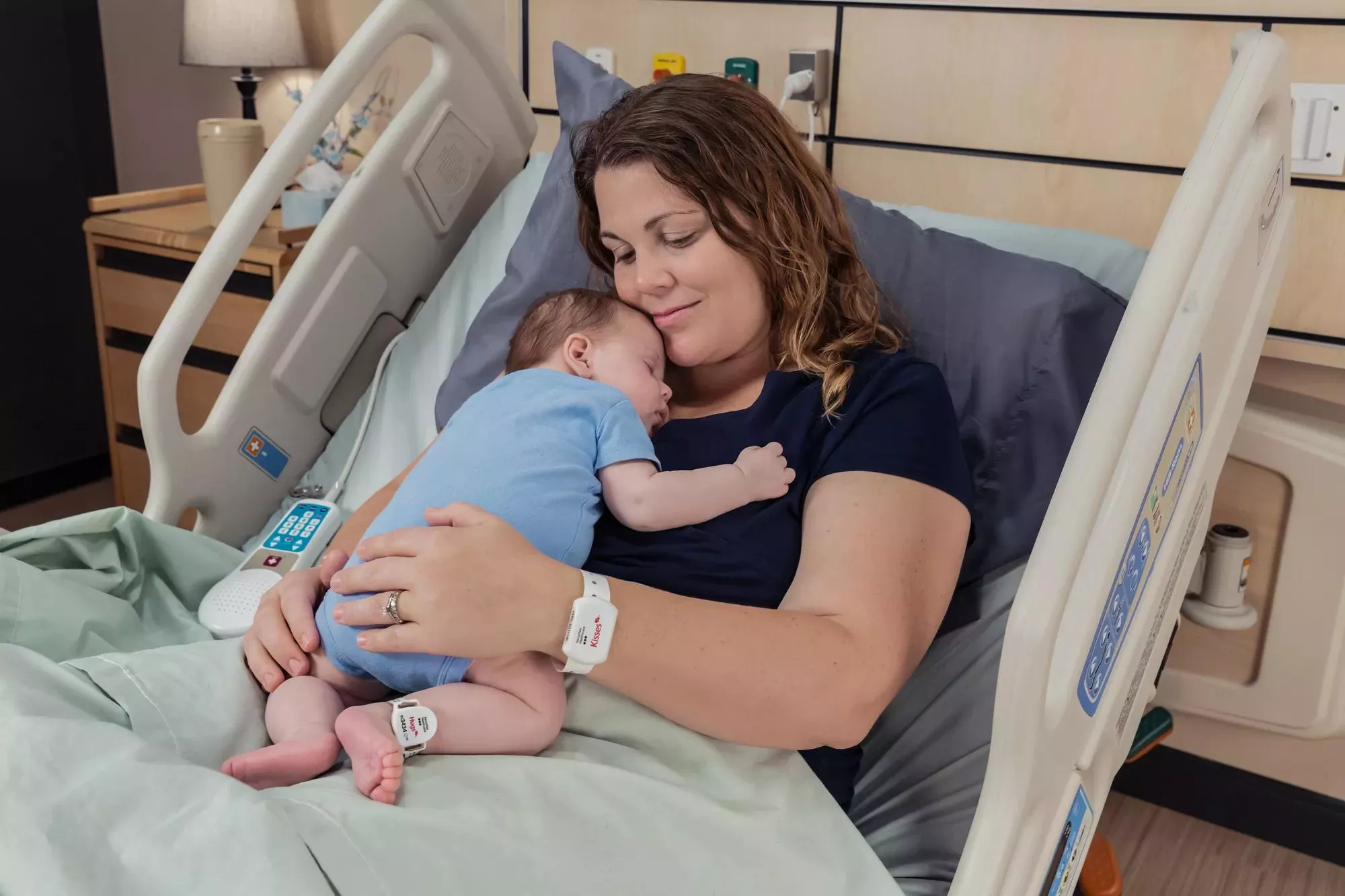 Baby and Mom utilizing the Kisses and Hugs infant protection - Securitas Healthcare.