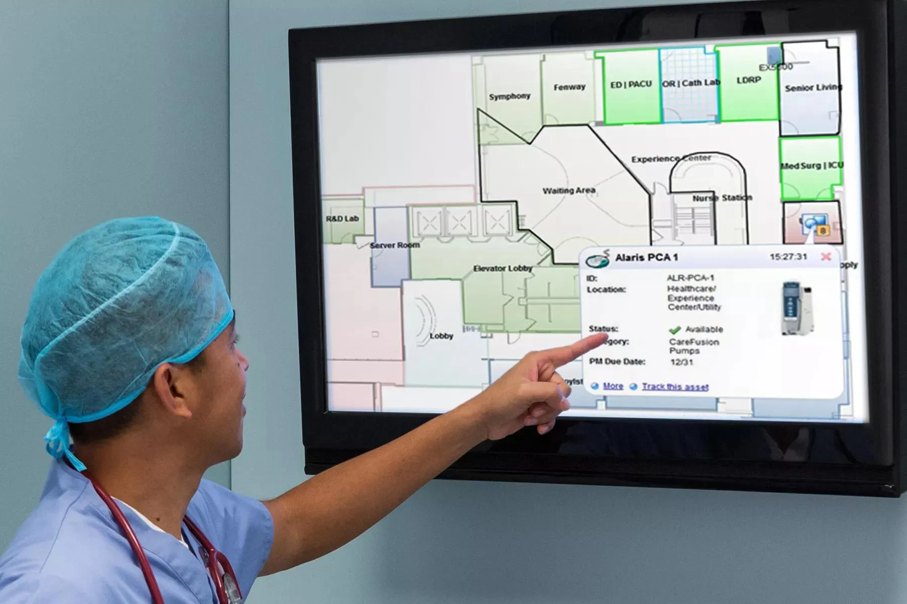 Healthcare worker using Securitas MobileView - viewing a screen to identify the location of a pump.