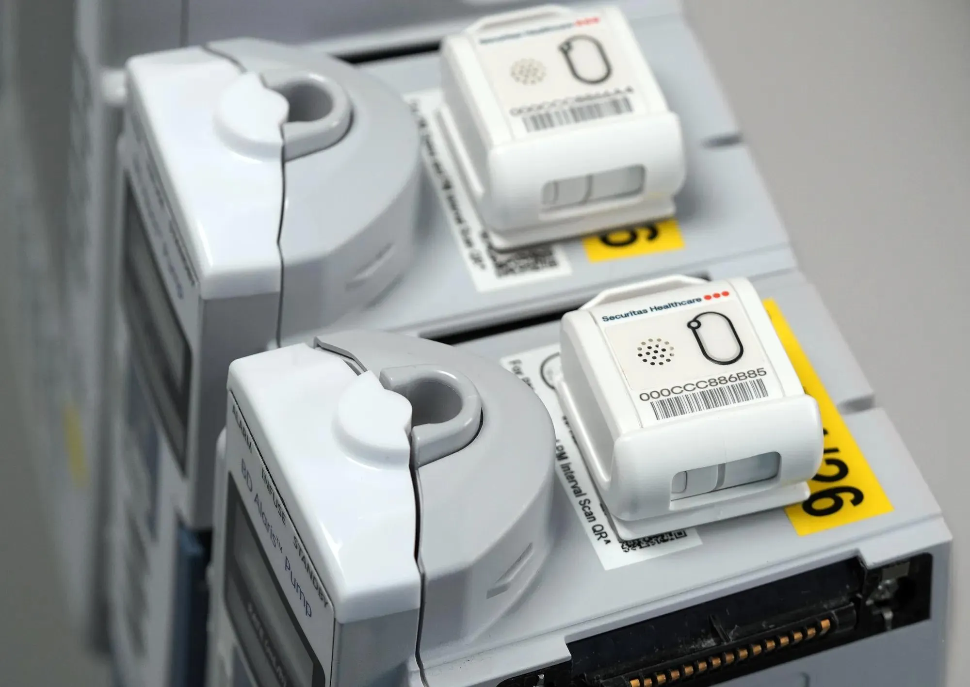 Securitas Healthcare T12sb tag for hospital asset tracking and management, as mounted on infusion pumps