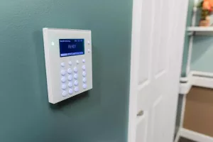 WanderGuard BLUE wall keypad ready to monitor doorway for wandering residents