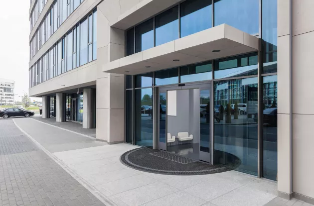 Closeup of a glass entrance to office building