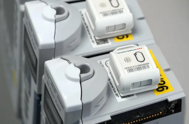 Securitas Healthcare T12sb tag for hospital asset tracking and management, as mounted on infusion pumps