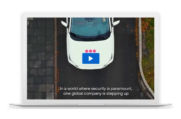 Overhead view of a Securitas branded car driving down the road.
