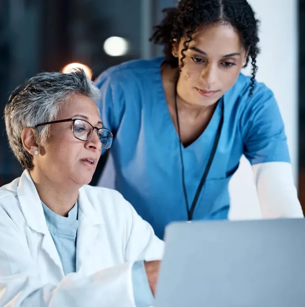Doctors, nurse or laptop in night teamwork, medical research or surgery planning in wellness hospital. Talking, thinking or healthcare women on technology for collaboration help or life insurance app